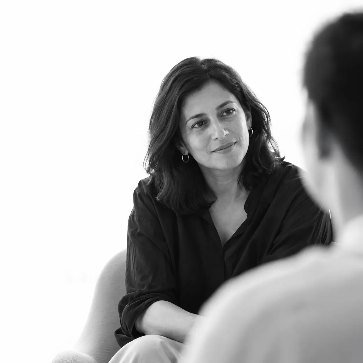A therapist listening attentively to a client